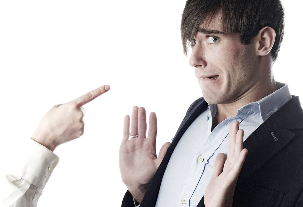 person pointing at someone else